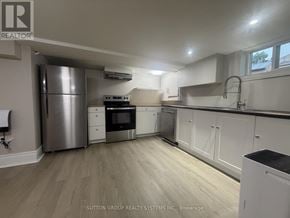 Toronto (Mount Dennis) apartment for rent - A kitchen with a stainless steel refrigerator, oven, and cabinets.