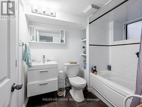 Toronto (Little Portugal) apartment for rent - A white bathroom with a toilet, sink, and bathtub.