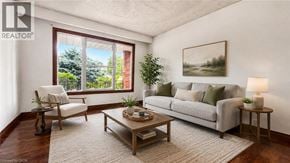 Hamilton apartment for rent - A living room with a couch, chair, and a table with a lamp on it.