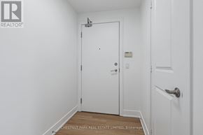 Toronto (Mount Pleasant West) condo for rent - A white door in a room with a Chestnut Park Real Estate Limited sign on the bottom.