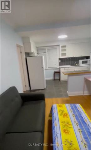 Toronto (Pleasant View) apartment for rent - A living room with a couch and a table.