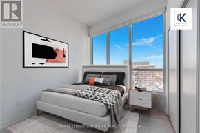 Toronto (Bayview Village) condo for rent - A bedroom with a large bed and a painting on the wall.