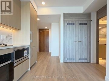Toronto (Bayview Village) condo for rent - A kitchen with a stove top oven and a microwave.