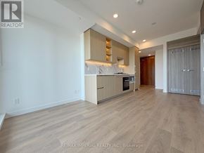 Toronto (Bayview Village) condo for rent - A spacious kitchen with wooden flooring and modern appliances.