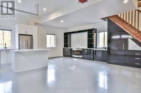Oro-Medonte apartment for rent - A spacious kitchen with a white countertop and black cabinets.