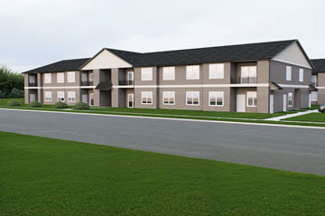 Robesonia apartment for rent - A large building with a grey roof and white walls.