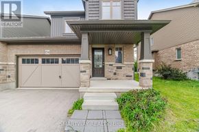 Grey Highlands townhouse for rent - A modern house with a garage and a front porch.