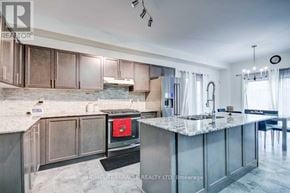 Cambridge apartment for rent - A modern kitchen with a marble countertop and stainless steel appliances.