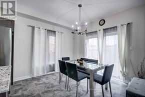 Cambridge apartment for rent - A dining room with a table set for two and a chandelier hanging from the ceiling.