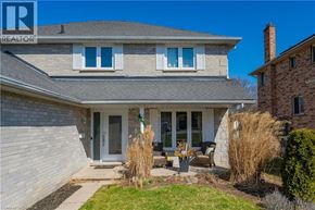 Cambridge apartment for rent - A house with a grey roof and a sign that says REALTOR.