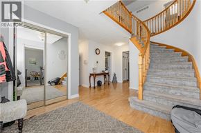 Cambridge apartment for rent - A living room with a staircase and a grey rug.