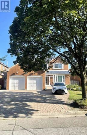 Markham (Milliken Mills East) apartment for rent - A house with a white car parked in front.