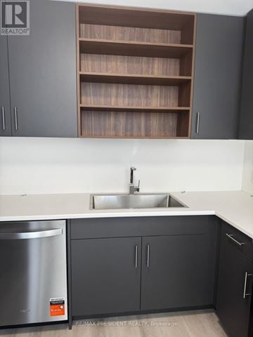 St. Catharines (Oakdale) townhouse for rent - A modern kitchen with a stainless steel dishwasher and a sink.