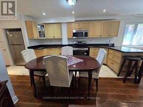 Newmarket (Summerhill Estates) apartment for rent - A kitchen with a table and chairs in the foreground.