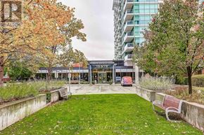 Toronto (Bayview Village) condo for rent - A park area with benches and a building in the background.