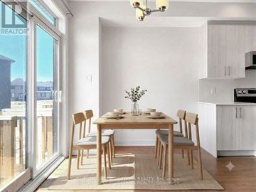 Ottawa townhouse for rent - A dining room with a table set for two and a view of the outside.