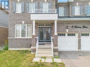 Thorold (Hurricane/Merrittville) apartment for rent - A two-story building with a balcony and a black door.