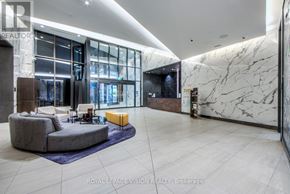 Toronto (Waterfront Communities) condo for rent - A spacious living room with a grey sofa and a yellow ottoman.