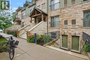 Waterloo townhouse for rent - A stone building with a bicycle parked in front.