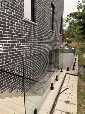 Pickering (Liverpool) apartment for rent - A brick wall with a glass railing.