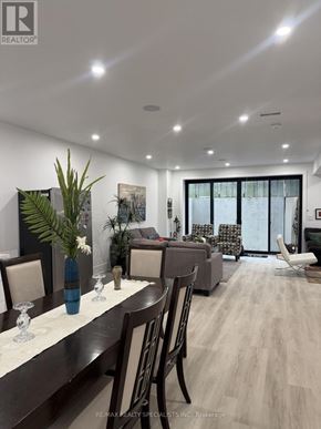 Pickering (Liverpool) apartment for rent - A dining room with a long table set for six.