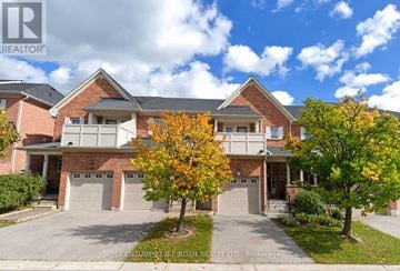 Whitby (Pringle Creek) townhouse for rent - A large house with a tree in front of it.