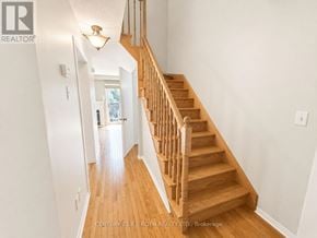 Whitby (Pringle Creek) townhouse for rent - A staircase with a light on the side wall.