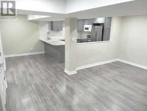 Clarington (Courtice) apartment for rent - A kitchen area with a counter and cabinets.