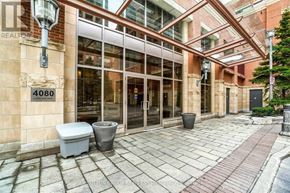 Mississauga (City Centre) condo for rent - The image shows a building entrance with a glass door and a sign that reads "4080".