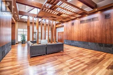 Mississauga (City Centre) condo for rent - A living room with a couch and a wooden floor.