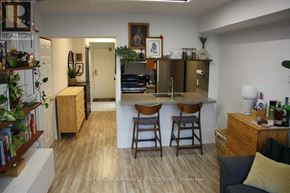 Mississauga (City Centre) condo for rent - A kitchen with a bar area and a dining table.