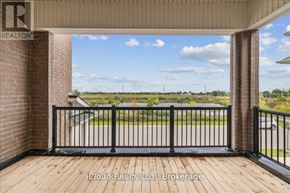 Milton (Cb Cobban) apartment for rent - A balcony with a black railing and a view of a street.