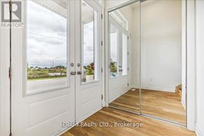 Milton (Cb Cobban) apartment for rent - A white door with a glass window and a wooden floor.