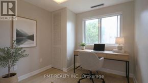 Toronto (Hillcrest Village) townhouse for rent - A room with a desk, chair, and a plant.