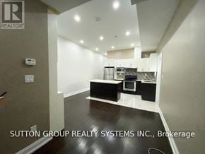 Toronto (Danforth) apartment for rent - A real estate sign for Sutton Group Realty Systems Inc. in Brokerage.