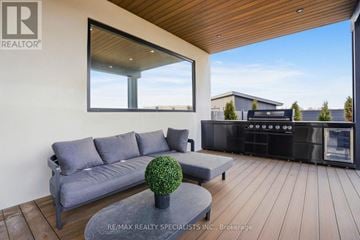 Amaranth apartment for rent - A modern living room with a grey sofa and a wooden coffee table.
