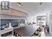 Toronto (Church-Yonge Corridor) condo for rent - A modern kitchen with a large island in the middle.
