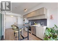 Toronto (Church-Yonge Corridor) condo for rent - A modern kitchen with a dining table and chairs.