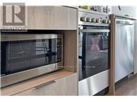 Toronto (Church-Yonge Corridor) condo for rent - A kitchen with a stainless steel oven and refrigerator.