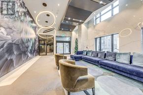 Toronto (Islington-City Centre West) condo for rent - A modern living room with a blue sofa and a large mural on the wall.