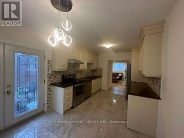 Richmond Hill (Mill Pond) apartment for rent - A well-lit kitchen with a marble floor and a glass door leading to a balcony.