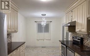 Richmond Hill (Mill Pond) apartment for rent - A kitchen with a refrigerator, microwave, and oven.