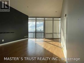 Toronto (Bay Street Corridor) condo for rent - A room with a large window and wooden flooring is for sale.