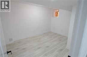 Waterloo apartment for rent - A room with wooden flooring and white walls.