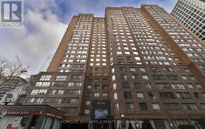 Toronto (Bay Street Corridor) condo for rent - A tall building with many windows and a sign that says 63rd.