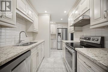 Toronto (L'amoreaux) condo for rent - A kitchen with white cabinets and a marble countertop.