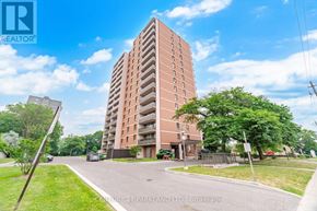 Toronto (L'amoreaux) condo for rent - A tall brick apartment building with a green lawn in front.