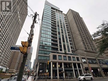 Toronto (Bay Street Corridor) condo for rent - A tall building with many windows is in the center of the image.