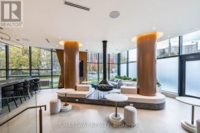Toronto (Islington-City Centre West) condo for rent - A modern interior space with a bar area and seating.