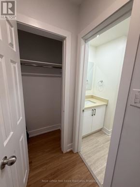 Toronto (Lansing-Westgate) multi-family for rent - A white door is open to a small bathroom.